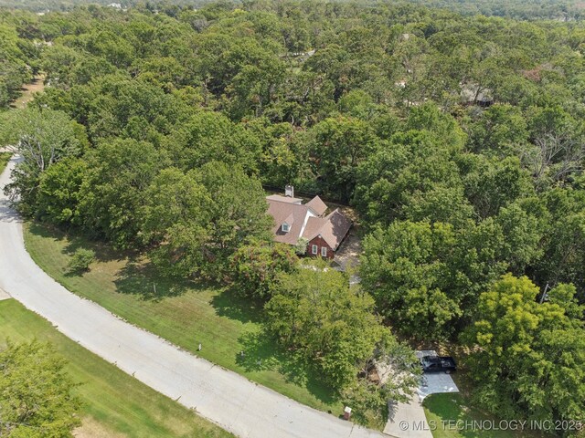 aerial view featuring a wooded view