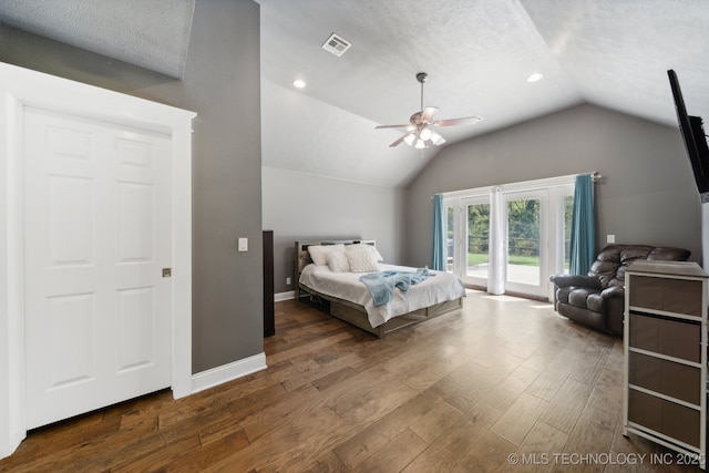 bedroom featuring dark wood-style floors, lofted ceiling, visible vents, access to outside, and baseboards