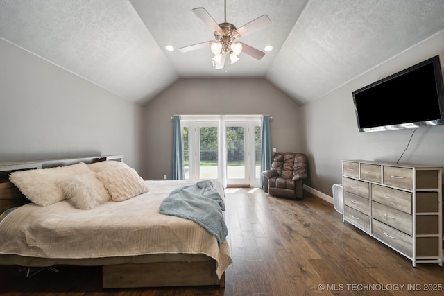 bedroom featuring dark wood finished floors, ceiling fan, access to outside, vaulted ceiling, and a textured ceiling