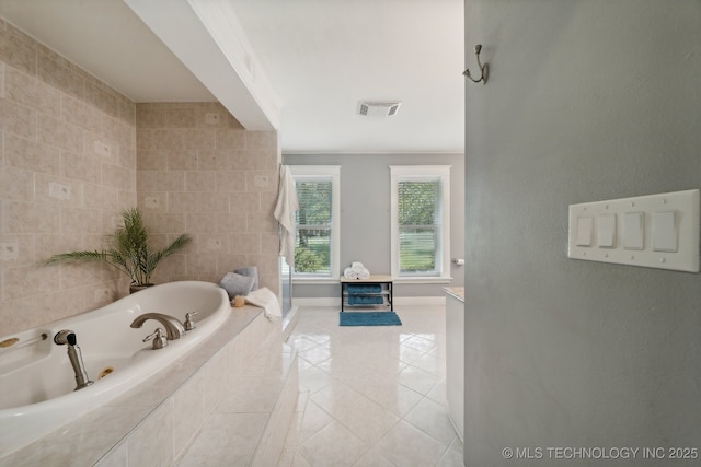 full bath with a shower with shower door, tile walls, visible vents, a bath, and tile patterned floors