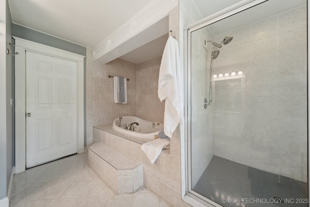 bathroom featuring a shower stall, a bath, and tile patterned floors