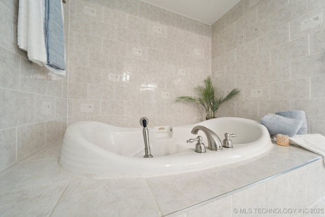 full bath with a bath and tile walls