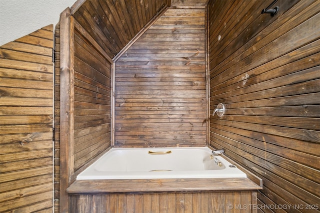 bathroom featuring a tub to relax in