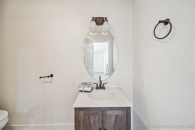 half bath with toilet and vanity