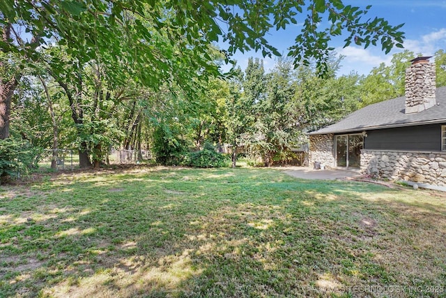 view of yard featuring a patio area and fence