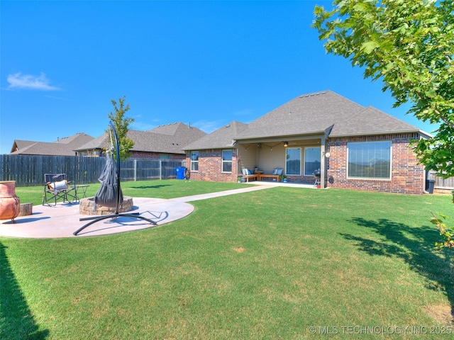 exterior space featuring a patio area, a fenced backyard, and ceiling fan