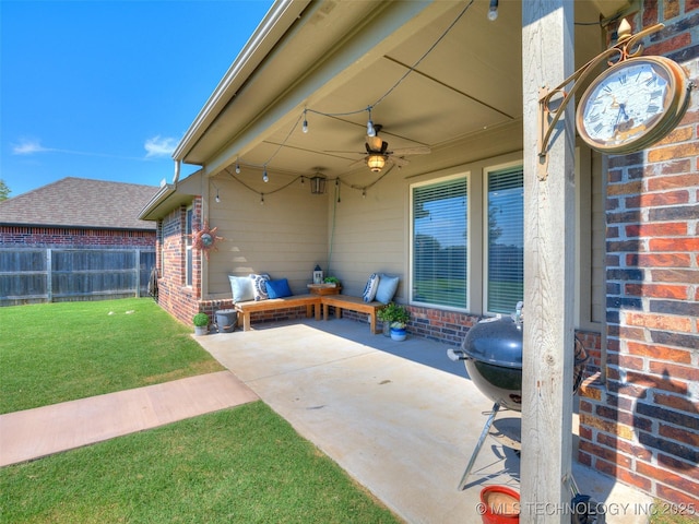 view of patio featuring fence and a ceiling fan