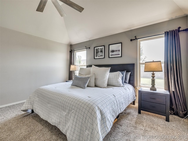 carpeted bedroom with vaulted ceiling, ceiling fan, and baseboards