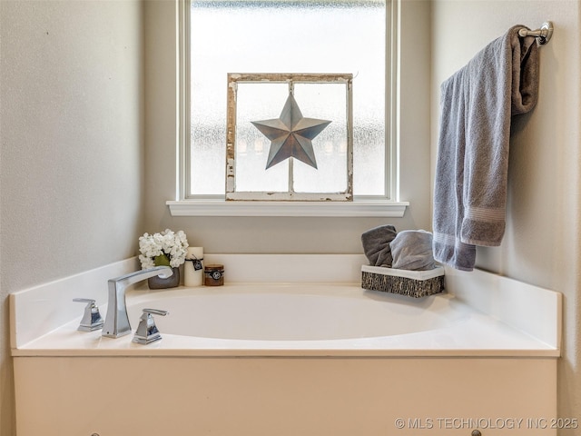 bathroom featuring a bath