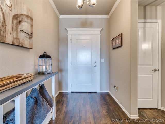 entryway featuring ornamental molding, wood finished floors, and baseboards