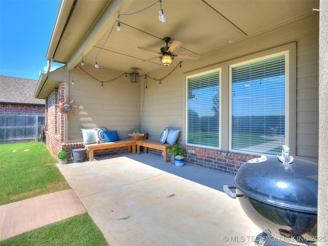 view of patio / terrace featuring fence and a ceiling fan