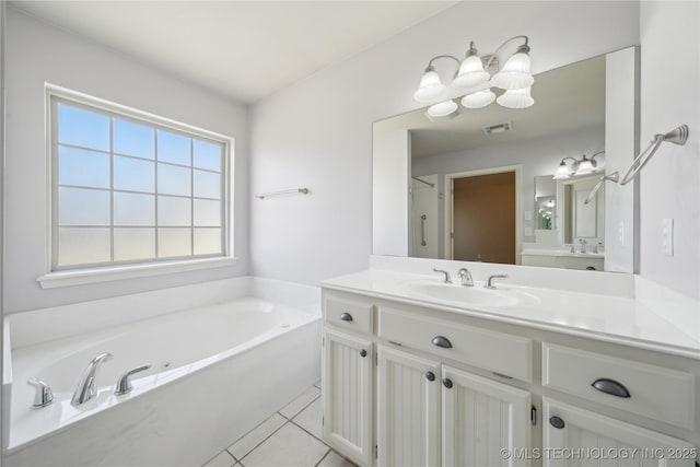 bathroom featuring vanity, visible vents, a bath, and tile patterned floors