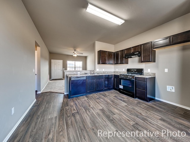 kitchen with black range with gas stovetop, a sink, under cabinet range hood, dishwasher, and a peninsula