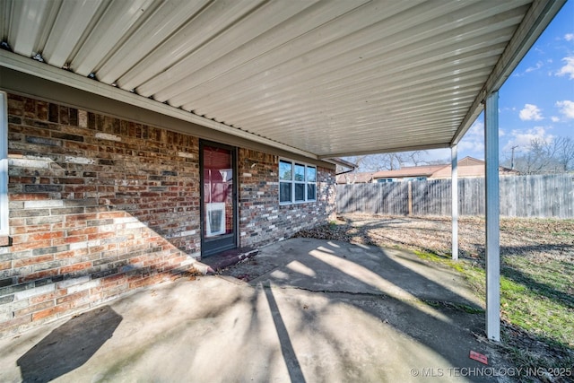 view of patio featuring fence