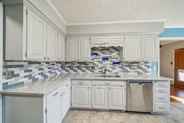 kitchen featuring a textured ceiling, a sink, light stone countertops, dishwasher, and crown molding