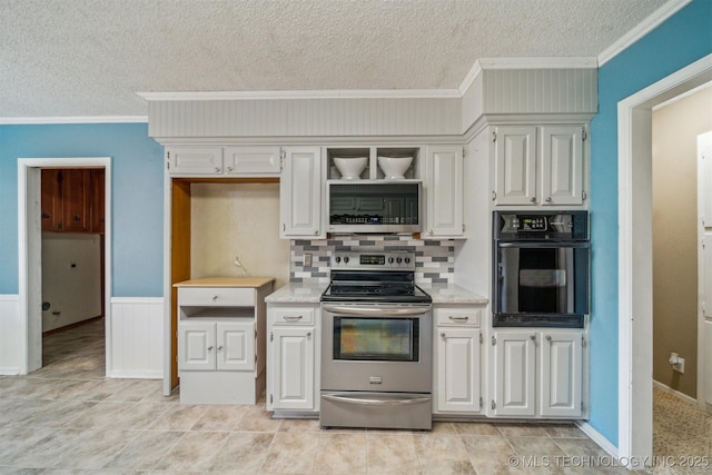 kitchen featuring electric range, ornamental molding, a textured ceiling, and black oven