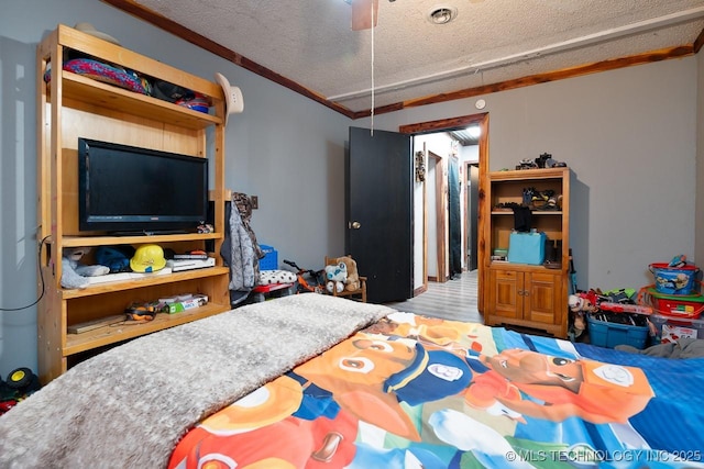 bedroom featuring a textured ceiling and wood finished floors