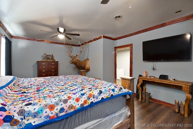 bedroom featuring a ceiling fan, crown molding, visible vents, and wood finished floors