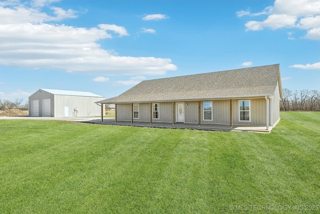 2374 N 205th Rd, Beggs, OK 74421 - back of property with an outbuilding, a garage, a lawn, and a shingled roof