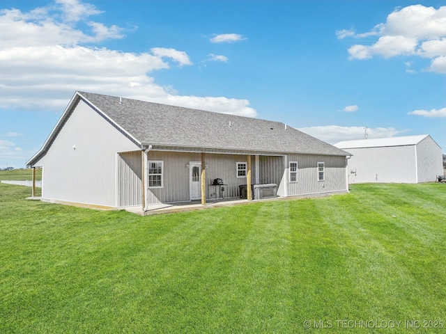 2374 N 205th Rd, Beggs, OK 74421 - back of house featuring a yard and a shingled roof