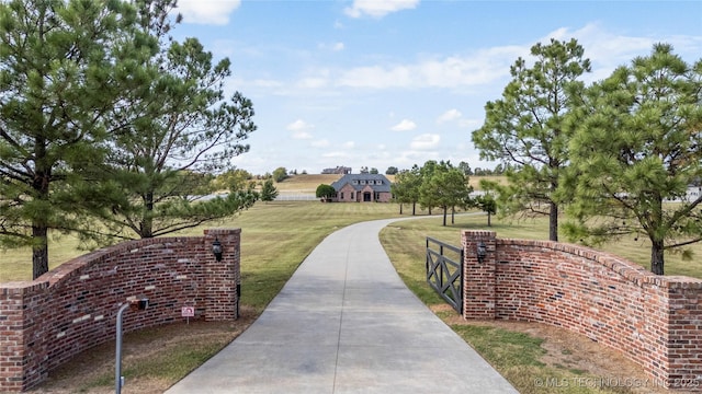 view of property's community with a yard