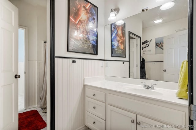 bathroom with wainscoting and vanity