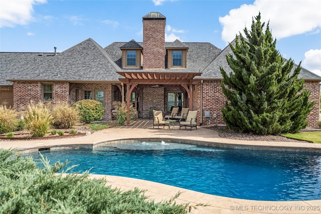 pool featuring a patio area and a pergola