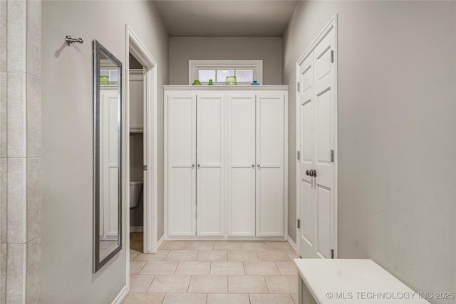 interior space with light tile patterned floors