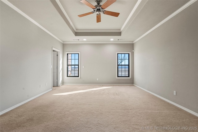 unfurnished room featuring carpet floors, crown molding, recessed lighting, a raised ceiling, and baseboards