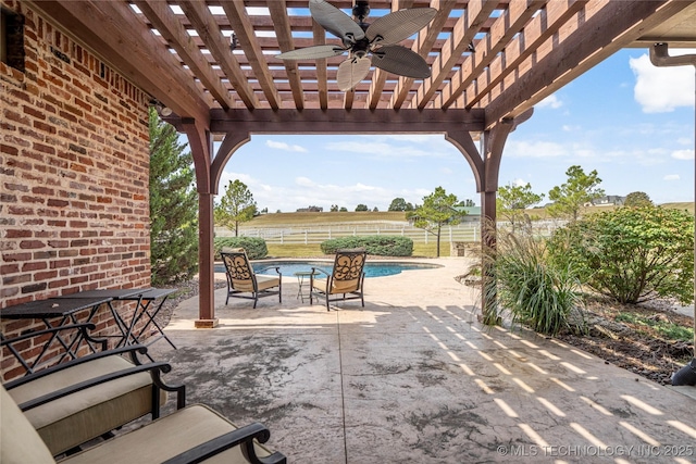 view of patio featuring a fenced in pool, fence, ceiling fan, and a pergola