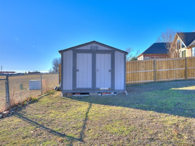 view of shed featuring a fenced backyard