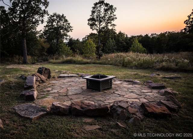 view of patio / terrace featuring a fire pit