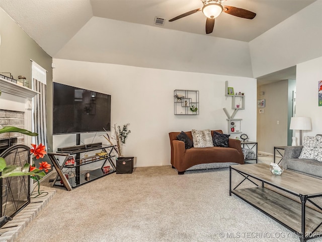 carpeted living area with lofted ceiling, visible vents, and a ceiling fan