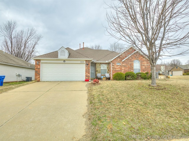 ranch-style home with a garage, brick siding, concrete driveway, cooling unit, and a front yard