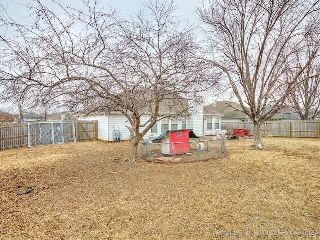 view of yard with a fenced backyard