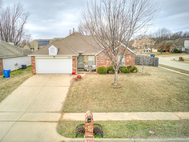 ranch-style house with brick siding, a shingled roof, concrete driveway, an attached garage, and central AC