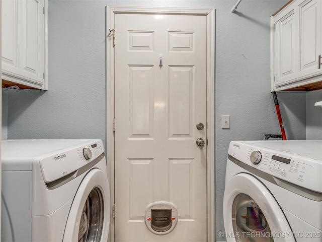 washroom featuring a textured wall, cabinet space, and washer and dryer