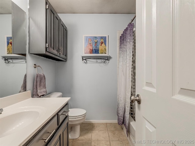 full bath featuring baseboards, toilet, tile patterned flooring, a textured ceiling, and vanity