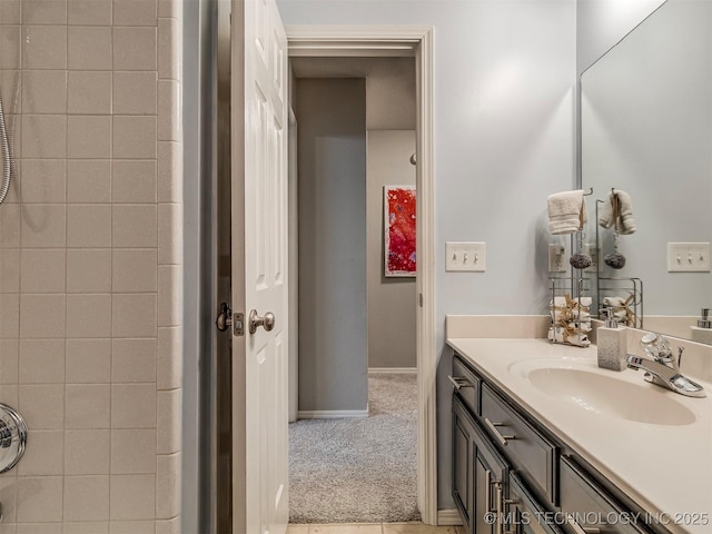 bathroom featuring vanity and baseboards