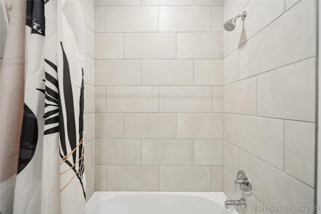 bathroom featuring shower / bath combo with shower curtain