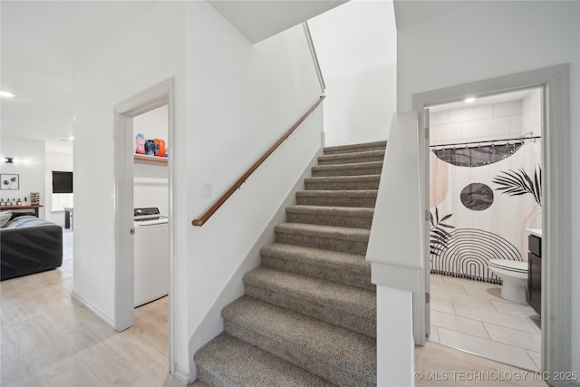 stairs with baseboards, wood finished floors, and recessed lighting