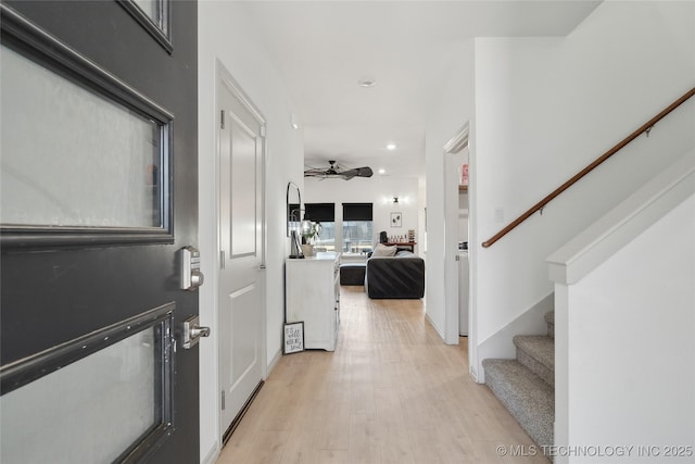 foyer with light wood-style flooring, recessed lighting, ceiling fan, and stairway