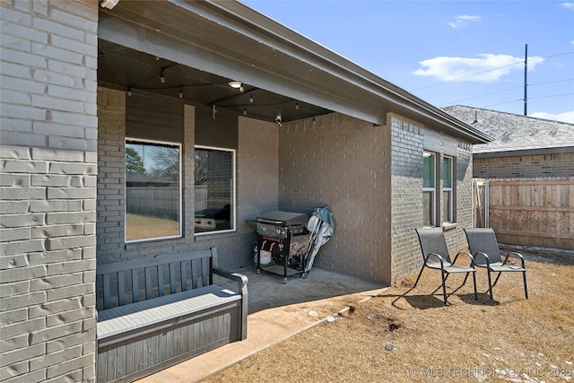 view of patio featuring fence and grilling area