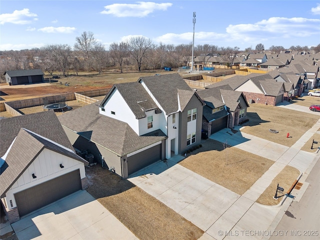 birds eye view of property with a residential view