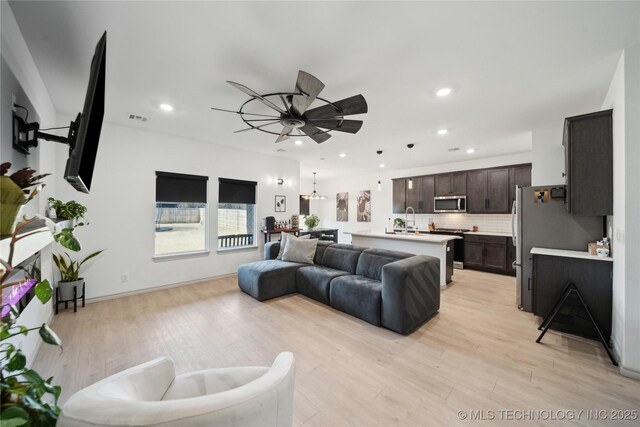 4632 S Chestnut Ave, Broken Arrow, OK 74011 - living area with light wood-style flooring, recessed lighting, and a ceiling fan