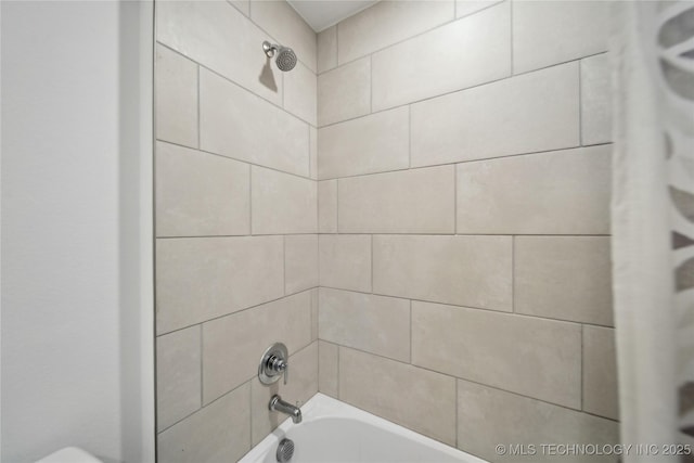 interior details with shower / bathing tub combination