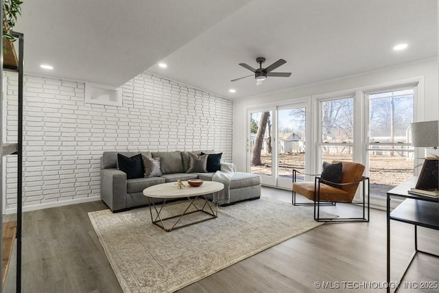 living area featuring recessed lighting, wood finished floors, brick wall, and ceiling fan