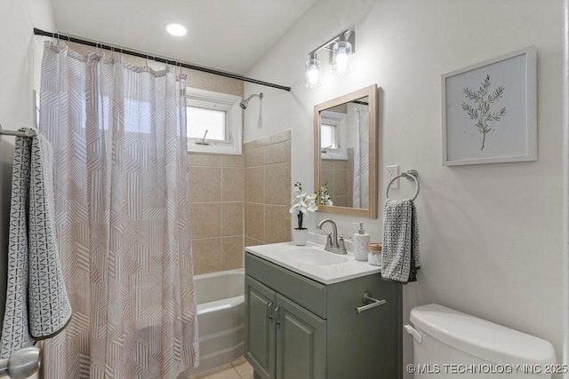 bathroom with vanity, toilet, and shower / bath combo