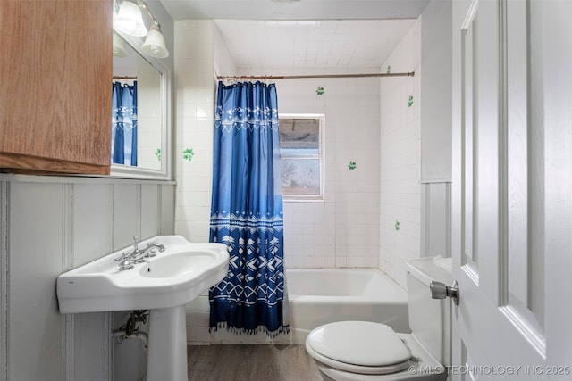 full bathroom with shower / bathtub combination with curtain, toilet, and wood finished floors