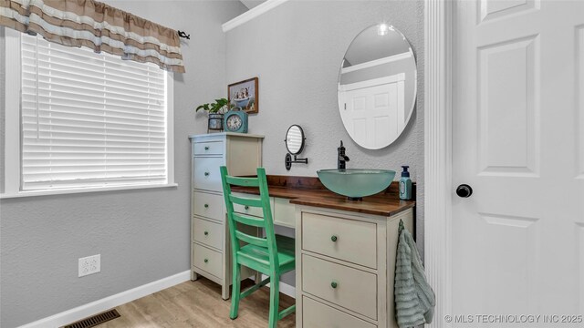 36953 US Highway 70, Bennington, OK 74723 - office space with a sink, light wood-type flooring, baseboards, and ornamental molding